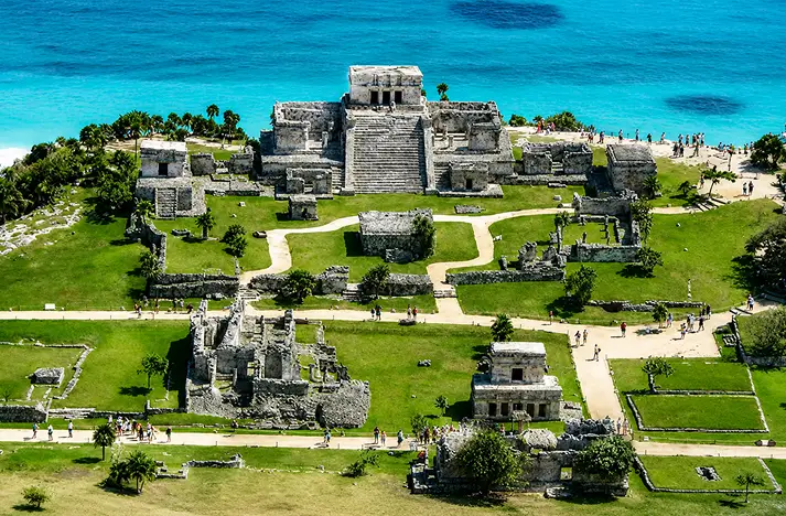 Aerial view of Tulum Mayan ruins overlooking the turquoise Caribbean Sea in Mexico