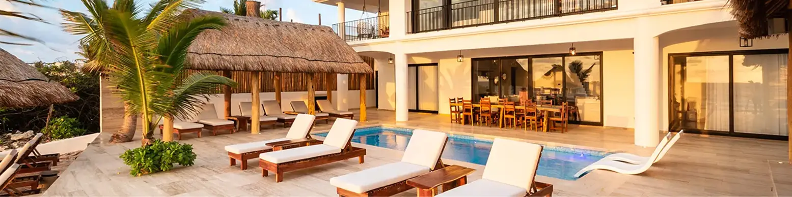Bella Vita Tulum private villa exterior pool and terrace at golden hour